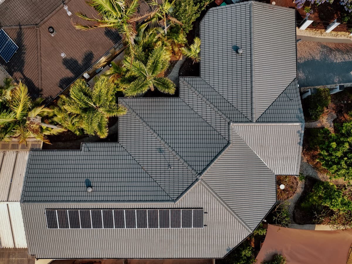 Completed roof restoration - aerial view of gray tile roof